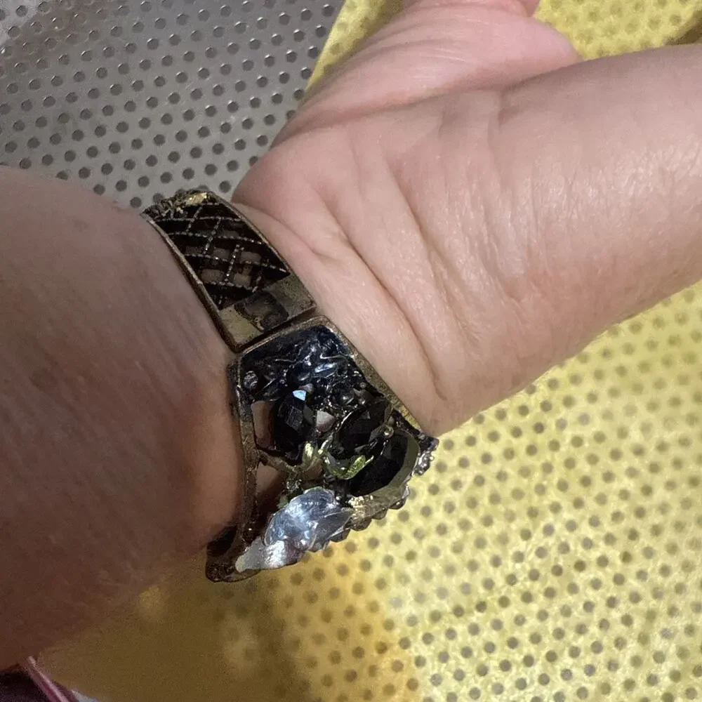 vintage-style floral women's cuff watch with a square face and black and silver-